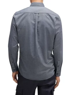 Chemise en coton bleue marine avec une coupe ajustée et des manches longues