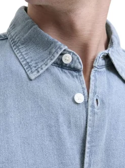 Chemise en coton bleue unie à coupe droite pourvue d'un col à revers
