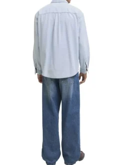 Chemise en coton bleue unie à coupe droite pourvue d'un col à revers