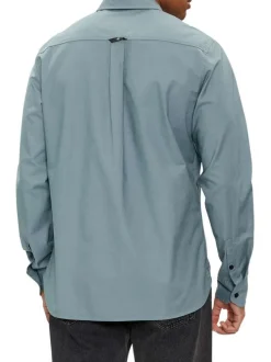 Chemise en coton bleue unie à coupe slim fit et à manches longues boutonnées