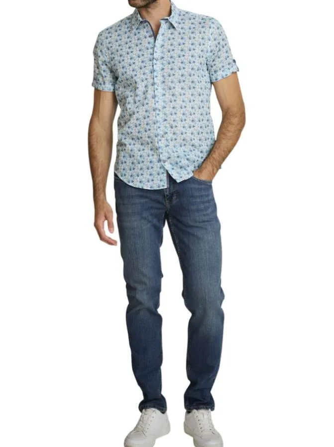 Chemise en coton ciel à coupe droite ornée d'un motif floral tricolore