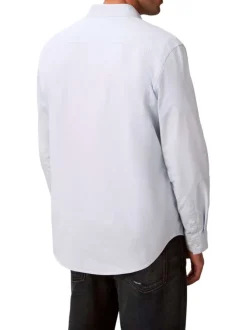 Chemise en coton ciel unie avec une coupe droite et un col à rabats