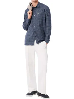 Chemise en coton marine à carreaux avec un col à rabats et des manches longues