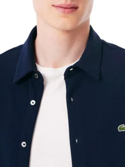 Chemise en coton marine unie avec un col à rabats et des manches longues