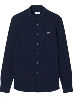 Chemise en coton marine unie avec un col à rabats et des manches longues