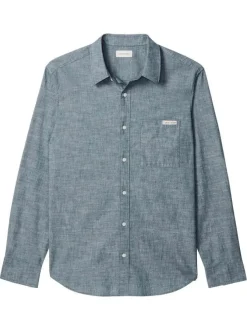 Chemise en coton marine unie avec une coupe droite et un col à revers
