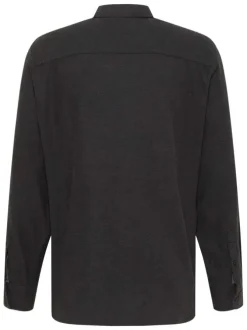 Chemise en coton noire avec un col chemise et poche sur la poitrine