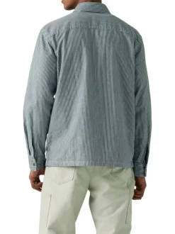 Chemise en coton rayée blanc et marine avec une fermeture par boutons