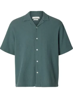 Chemise en coton verte unie pourvue d'une coupe droite et d'un col cubain