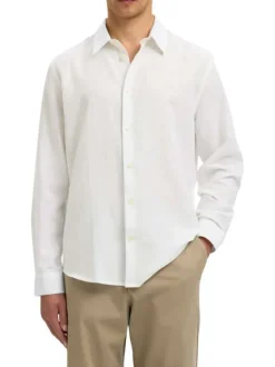 Chemise en lin et coton blanche uni avec une coupe ajustée et un col boutonné