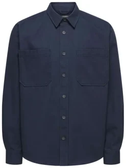 Chemise indigo unie en coton avec une coupe droite et un col à revers