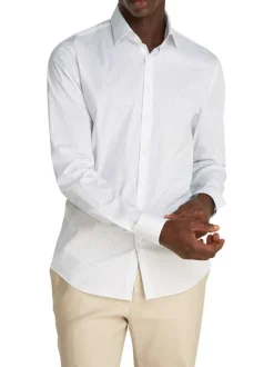 Chemise à manches longues en coton blanche à pois avec une coupe slim