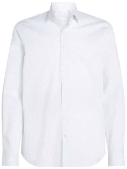 Chemise à manches longues en coton blanche à pois avec une coupe slim