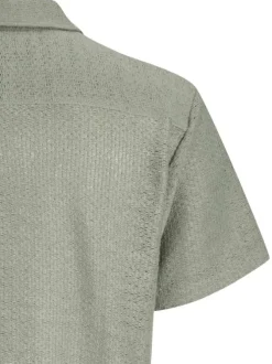 Chemise olive en crochet pourvue d'un col cubain et de manches courtes