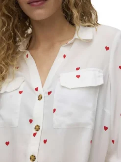 Chemisier blanc à motifs avec un col à revers et des manches longues