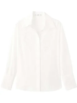 Chemisier blanc uni avec une coupe droite et un motif floral ajouré
