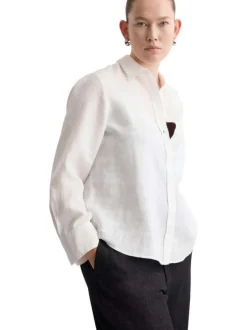 Chemisier blanc uni coupe ample avec un col à revers et des manches longues