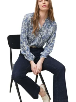 Chemisier bleu floral avec une coupe droite et un col tunisien