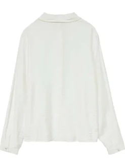 Chemisier écru uni avec un col chemise perlé et des manches longues
