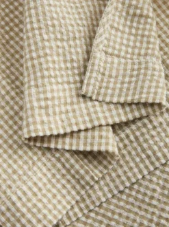 Chemisier en coton beige pourvu d'un motif à carreaux et de manches longues