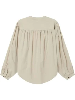 Chemisier en coton beige uni en velours avec une coupe ample et un col rond