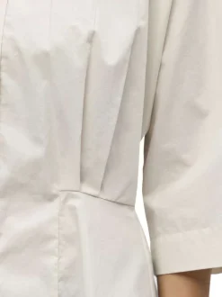 Chemisier en coton biologique écru uni pourvu d'une coupe cintrée