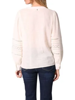 Chemisier en coton blanc avec un col v profond et des manches longues