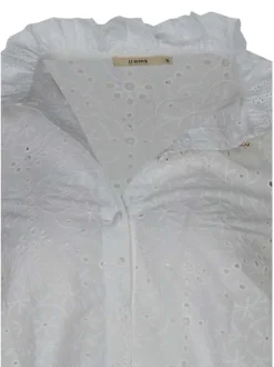 Chemisier en coton blanc uni avec une coupe droite et des manches longues