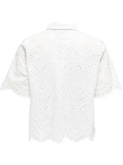 Chemisier en coton blanc uni avec une coupe droite et un col à revers