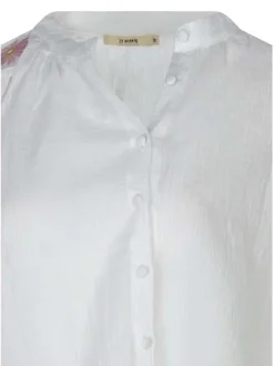 Chemisier en coton blanc uni avec une coupe droite et un col rond