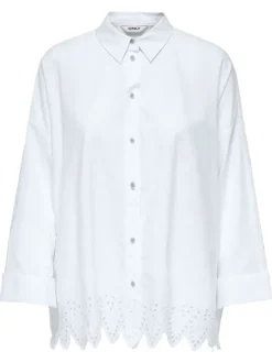 Chemisier en coton blanc uni à coupe longue avec de la broderie sur le bas