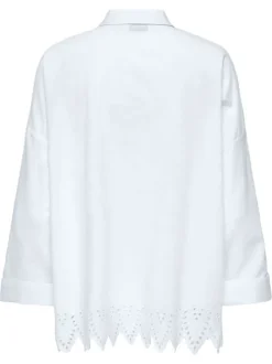 Chemisier en coton blanc uni à coupe longue avec de la broderie sur le bas