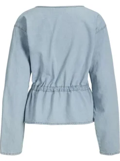 Chemisier en coton bleu clair pourvu d'un col v et de manches longues