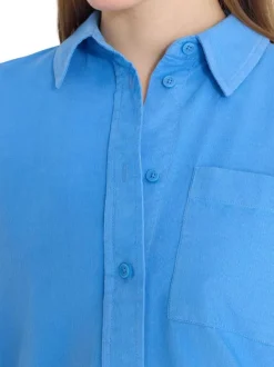 Chemisier en coton bleu uni pourvu d'une coupe droite et d'un col français