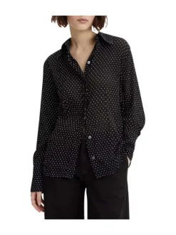 Chemisier noir transparent avec un imprimé à pois blancs et des manches longues