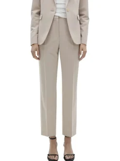 Chino beige uni avec pli marqué et des poches à l'italienne à l'avant