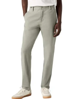 Chino en coton beige uni avec une coupe slim et des passants pour ceinture