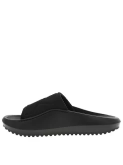 Claquettes noires à semelle épaisse plate avec un coup-de-pied textile