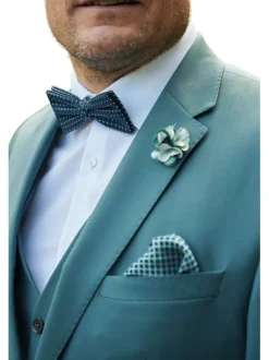 Costume vert uni en laine avec une veste et un pantalon à coupe ajustée