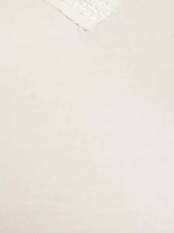 Débardeur blanc uni avec des bretelles et une coupe droite à col v