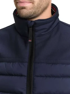 Doudoune marine uni avec une fermeture zippée et un col montant