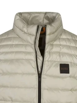 Doudoune sans manches beige unie avec un col montant et une coupe droite