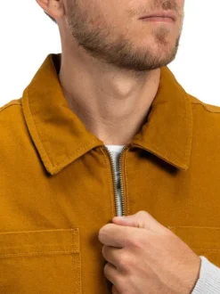 Doudoune sans manches en coton moutarde uni avec un col chemise