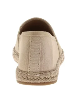Espadrilles beiges avec un talon plat et un petit soufflet élastiqué