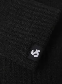 Gants noirs unis avec le logo iconique au poignet et les bords côtelés