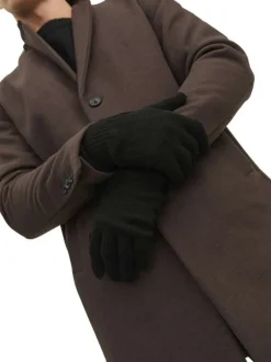 Gants noirs unis avec le logo iconique au poignet et les bords côtelés