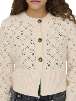 Gilet beige en maille ajourée pourvu d'un col rond et de manches longues