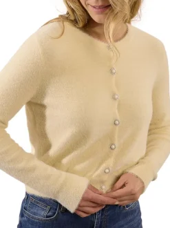 Gilet écru en maille fine avec une coupe droite et des manches longues