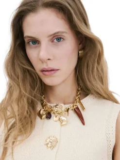 Gilet écru uni avec une coupe ajustée et des boutons-fleurs dorés