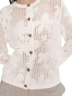 Gilet en coton écru uni pourvu d'une coupe ajustée et d'un col rond